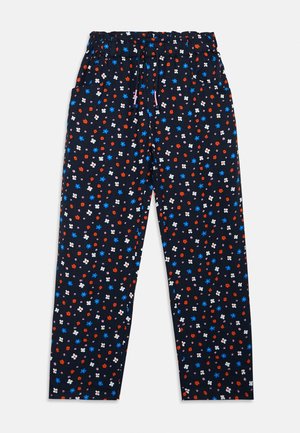 Pantalon bleu marine avec taille élastique et cordon, décoré de petits motifs floraux rouges, blancs et bleus dispersés.