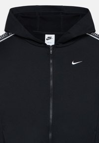 Black Nike zip-up hoodie with hood, white Nike swoosh on chest, and Nike branding on shoulder tape.