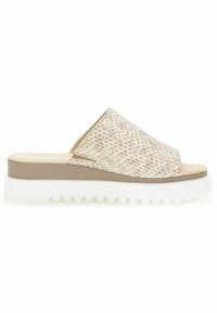 Lichte schuifslipper in beige met een gestructureerde bovenkant in reptielpatroon. Voorzien van een witte, getande zool met een subtiele tan-accent.