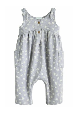 Lichtblauwe, mouwloze jumpsuit met een wit madeliefjespatroon, houten knopen en twee zijzakken. Zachte stof met een geaccentueerde taille.