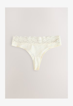 Šviesios kreminės spalvos aukštu liemeniu apatinės kelnaitės su nėriniais. Pagamintos iš minkštos medžiagos, turi subtilų nėrinių juosmenį ir minimalų galinį dangą.