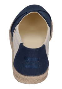 Canvas espadrille with a navy blue upper, tan striped accents, and a jute rope sole. Interior is light beige. Features a stitched logo.