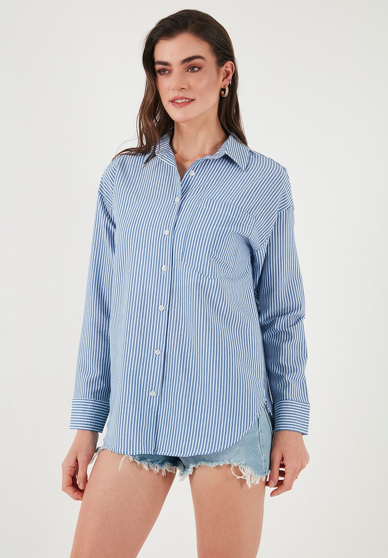 Blue and white striped button-up shirt with long sleeves and a chest pocket. Fabric appears lightweight with a smooth texture.