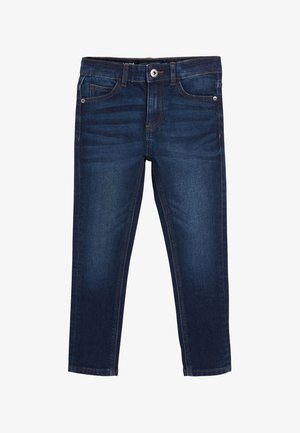 Jeans en denim bleu foncé slim fit avec poches avant, fermeture à boutons et légère décoloration au niveau des cuisses.