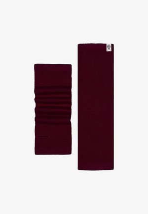 Burgundy knitted scarf and matching neck warmer. Scarf is long and flat; neck warmer is shorter with gathered texture. Both feature a small logo.