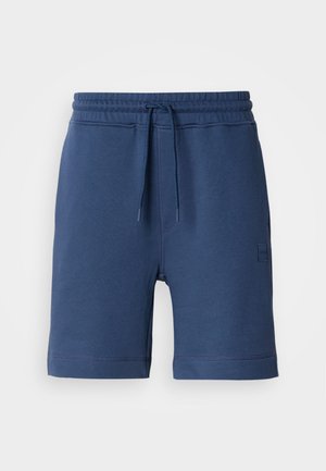 Marineblaue Baumwollshorts mit elastischem Bund, Kordelzug und Seitentaschen. Mit einem kleinen Logo-Patch auf der linken Seite.