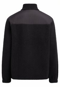 Jachetă din polar neagră, cu un material texturat și pufos. Prezintă un panou superior solid negru și un guler înalt. Design moale și cald.