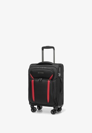 Valise noire avec accents rouges, tissu texturé, quatre roues, compartiments à double fermeture éclair et une poignée télescopique.