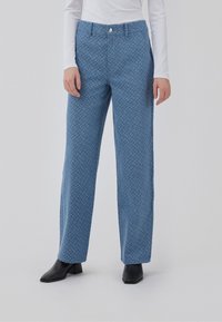 Blue patterned trousers with a straight cut, made of a lightweight fabric, featuring a button closure and side pockets.