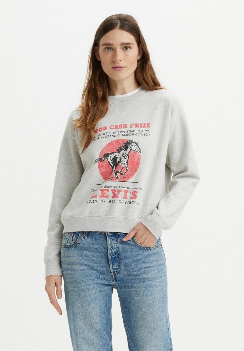 Grijze sweatshirt met lange mouwen, voorzien van een afbeelding van een paard en tekst. Ontspannen pasvorm met ribgebreide manchetten en zoom, lichtgewicht stof.