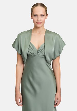 Green satin dress with pleated bodice and a shawl-style short overlay. Smooth texture, fitted silhouette, and deep V-neck.