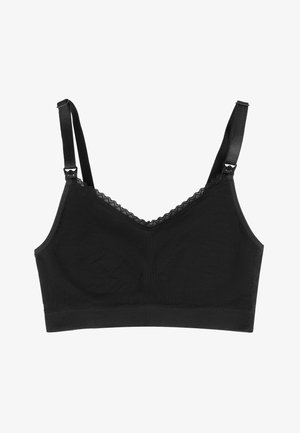 Zwarte bralette met verstelbare bandjes, kantafwerking langs de halslijn en een gladde stoftekstuur. Geen padding of beugel inbegrepen.
