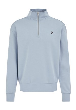 Svetlomodrý pulóver na zips so stojačikom a voľným strihom. Má rebrované manžety a lem, s malým čiernym logom vtáka na hrudi. Mäkká látka.