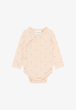 Kreemivärvi pika varrukaga beebivooder, millel on beeži südamekujulised mustrid ja nööbid külgedel ning alläärtes.