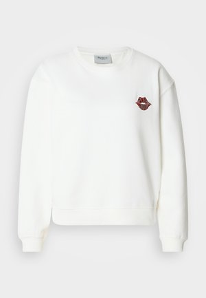 Sudadera blanca con diseño corto, mangas largas, puños acanalados y un gráfico de labios rojos con el texto "LONDON" en el pecho.