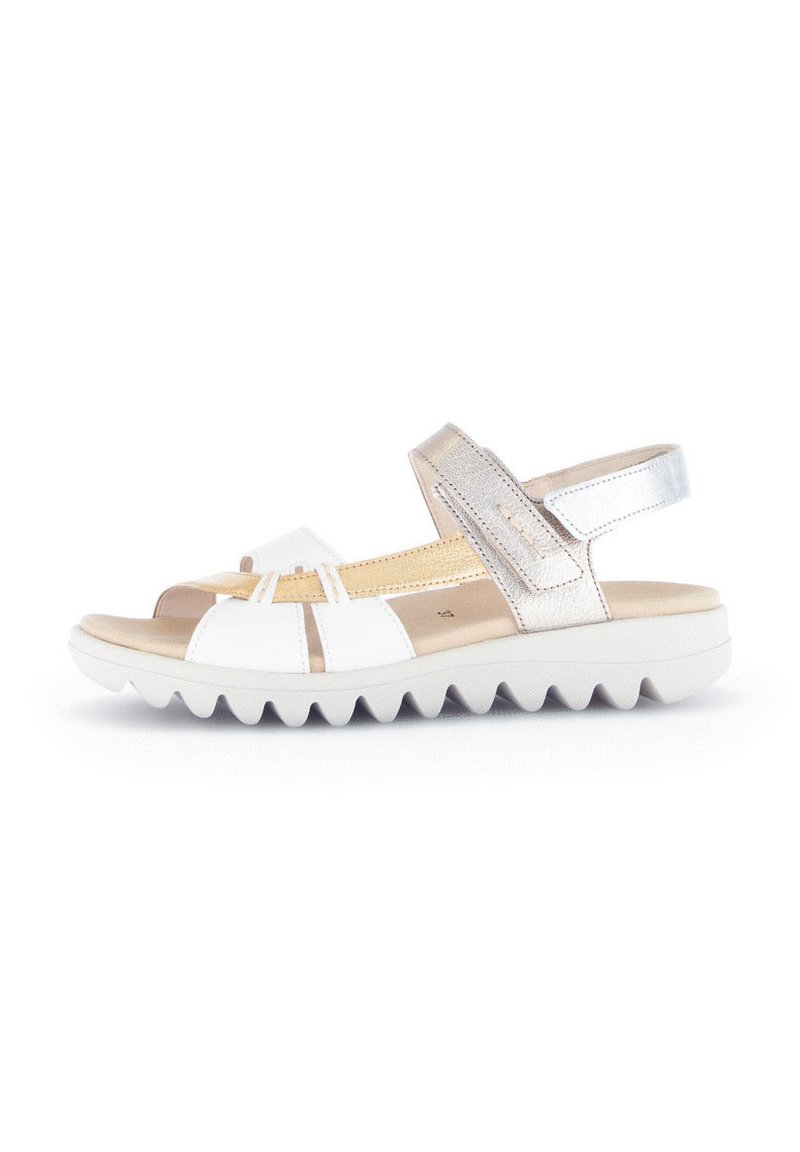 White and metallic silver sandal featuring a textured footbed, open design, adjustable strap, and a white ridged sole for traction.