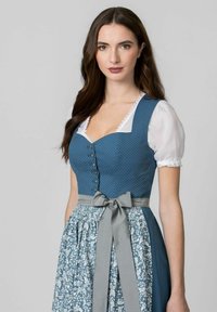 Blue dotted bodice with silver buttons, white puff sleeves, and floral-patterned skirt. Finished with a gray ribbon tie at the waist.