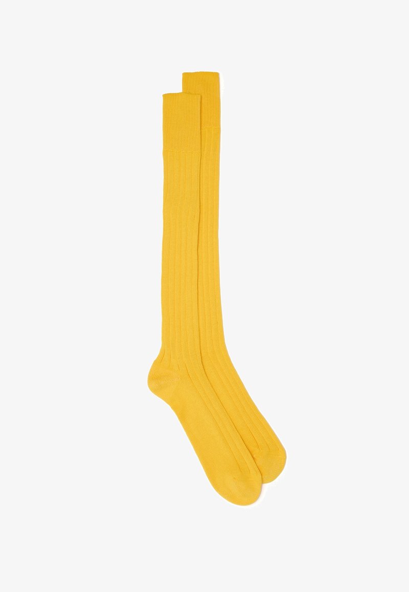 Gelbe, knielange Socken in ribbeliger Textur mit verstärktem Zehen- und Bündchendesign. Weicher Stoff mit glatter Oberfläche.