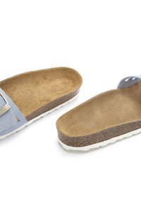 Blue suede slide sandals with a light brown suede footbed and cork midsole. White rubber outsole with a textured grip pattern.