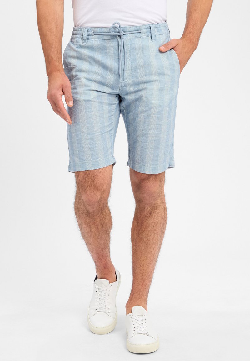 Light blue shorts made of a textured fabric, featuring a drawstring waist, side pockets, and a subtle horizontal pattern.