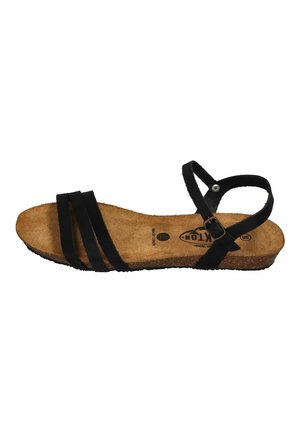 Flache Sandale mit braunem Korkfußbett und drei schwarzen Riemen über den Zehen, plus verstellbarem schwarzen Knöchelriemen mit Metallschnalle.