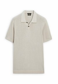 Lyhythihainen vaaleanbeige polopaita, jossa on rouhea kangas, sileä kaulus, kaksi nappia ja suora helma.