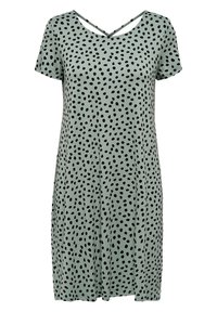 Lyhyet hihat omaava kevyt vihreä mekko mustilla laikkuilla, jossa on V-mallinen kaula-aukko ja ristikkäiset hihnat selässä. Pehmeä ja kevyt materiaali.