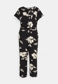 Svart blomstrete jumpsuit med korte ermer, v-hals og knyttet midje. Har store hvite blomster og grønne blader, glatt stoff.
