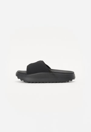 Black slide sandal with a smooth texture, wide top straps, and a cushioned sole featuring a ridged pattern for traction.