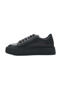 Black sneaker with a textured leather upper, round toe, flat black sole, and six eyelets for laces. Simple design with no visible logos.