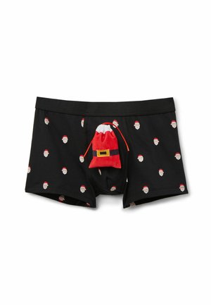 Boxers noirs avec un motif répété de visage de Père Noël. Comprend un détail de sac en peluche rouge et blanc de Père Noël à l'avant.