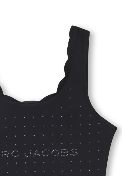 Maillot de bain noir avec des bretelles festonnées, orné de petites rhinestones dans un motif à pois et d'un logo aux accents brillants sur le devant.