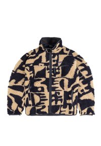 Giacca in pile beige e blu marin, con un motivo testurizzato. Chiusura con zip, colletto alto e tasche laterali con rifiniture a contrasto.