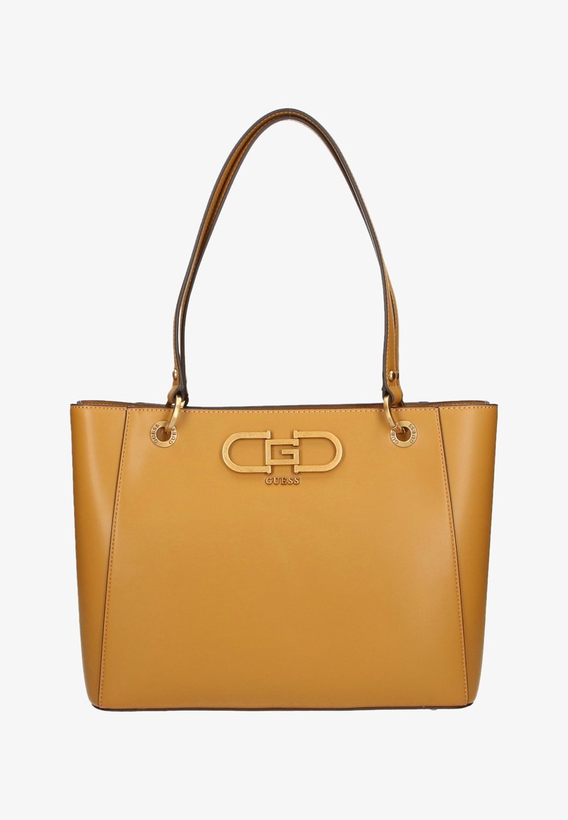 Sac à bandoulière en cuir camel avec deux anses et logo GUESS en métal doré au centre avant.