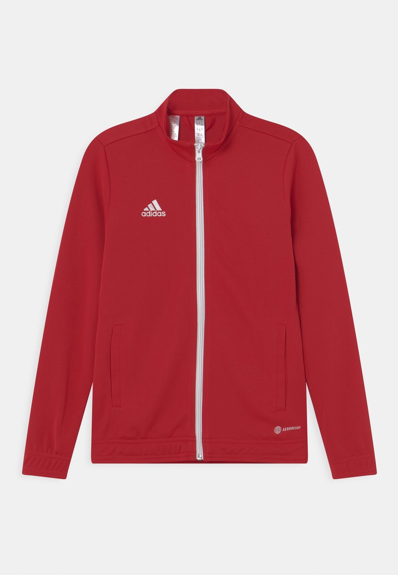 Röd sportjacka i slätt tyg, med hög krage, fullt blixtlås, två sidofickor och vit adidas-logga samt detaljer.