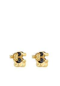 Pendientes en tono dorado con un diseño floral, adornados con piedras preciosas negras, acabado pulido y cierre trasero seguro.