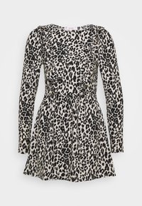 Kjol med leopardtryck, långa ärmar, volangdetaljer, åtsittande midja och utsvängd kjol. Tillverkad av lätt tyg i beige och svarta färger.