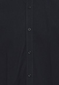 Dark navy button-up shirt featuring a classic collar, front placket with six black buttons, and subtle stitching detail. Cotton blend fabric.