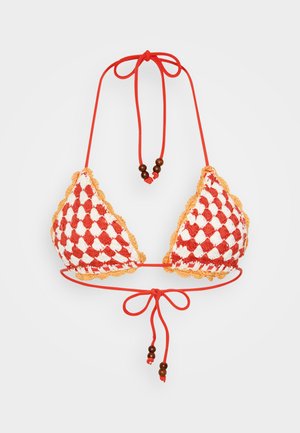 Crochet bikini top in red and white checker pattern. Features scalloped edges, adjustable ties, and wooden bead accents. Textured material.