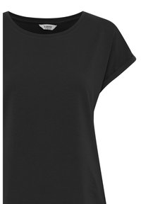 T-shirt nera a maniche corte con scollo tondo e tessuto morbido e liscio. La maglietta presenta orli arrotolati e una vestibilità comoda.