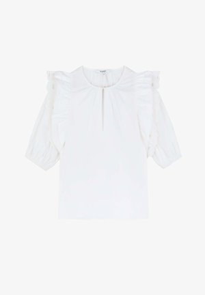 Camicia bianca con maniche a sbuffo corte, caratterizzata da dettagli arricciati e un colletto a chiave discreto. Tessuto liscio con una texture semplice.