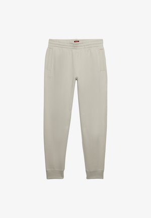 Light gray sweatpants made from soft fabric, featuring an elastic waistband, two side pockets, and ribbed cuffs at the ankles.