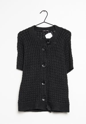 Short-sleeve, dark gray knitted cardigan with textured pattern, five black buttons down the front, and a ribbed hem. Hangs on a hook.