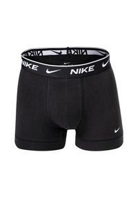 Schwarze Boxer-Shorts mit einem Nike-Logo-Bund, ausgestattet mit einer körpernahen Passform und weichem Material. Akzente sind das weiße Logo und die weißen Nähte.