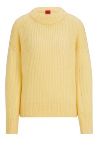 Gul stickad tröja med polokrage, ribbade muddar och fåll. Har en lös passform och texturerat tyg, designad för komfort.