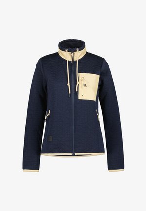 Giacca navy trapuntata con colletto alto, dettagli in crema, tasca sul petto con zip e cordini regolabili. Presenta tasche laterali con zip.