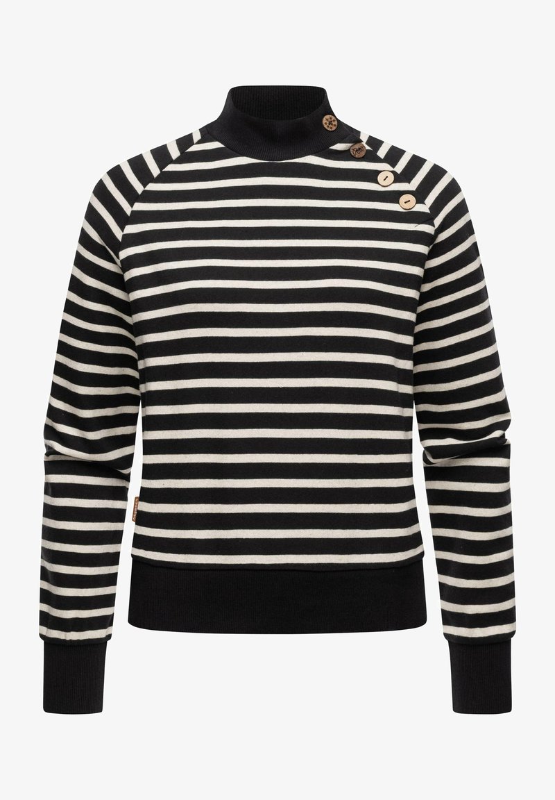 Raidallinen neule musta- ja kerma-aprikoosissa, jossa on nukkaharso, raglanhihoja ja kolme koristeellista puunappia olkapäällä.