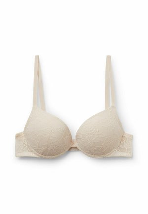 Soutien-gorge en dentelle beige avec bonnets lisses et rembourrés, bretelles réglables et fermeture à agrafes. Motif en dentelle florale couvre les bonnets et la bande.