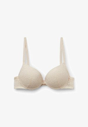Soutien-gorge en dentelle beige avec bonnets lisses et rembourrés, bretelles réglables et fermeture à agrafes. Motif en dentelle florale couvre les bonnets et la bande.