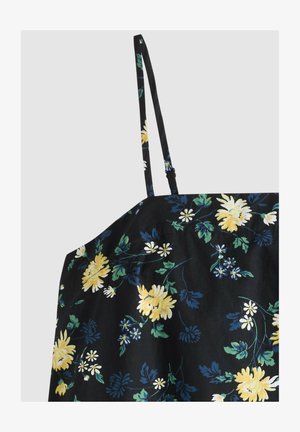 Zwarte spaghetti-strap top met gele, witte en blauwe bloemenprint en groene bladeren, getoond vanaf de bovenkant voorkant met verstelbare bandjes.